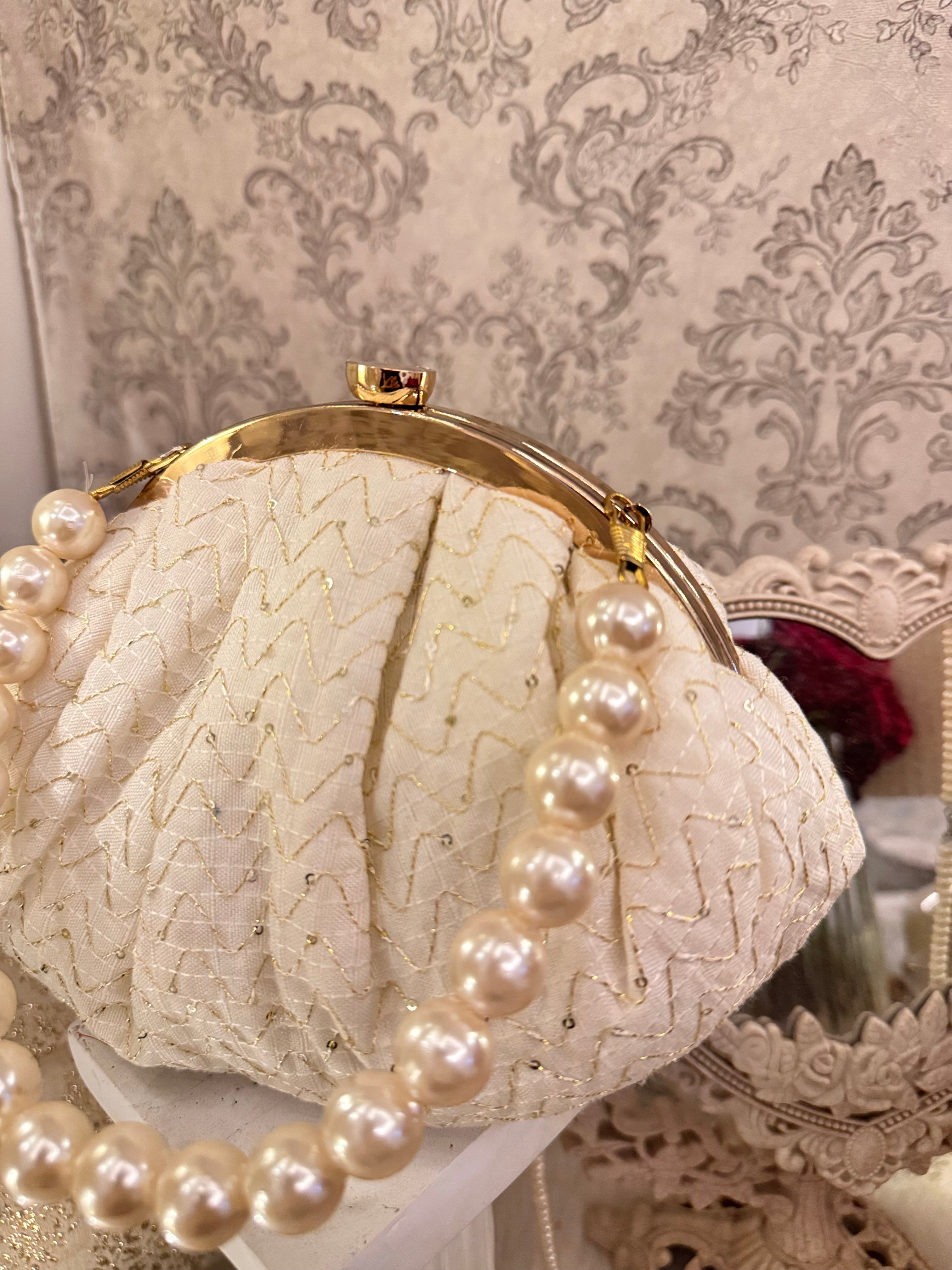 Pearl eclat clutch