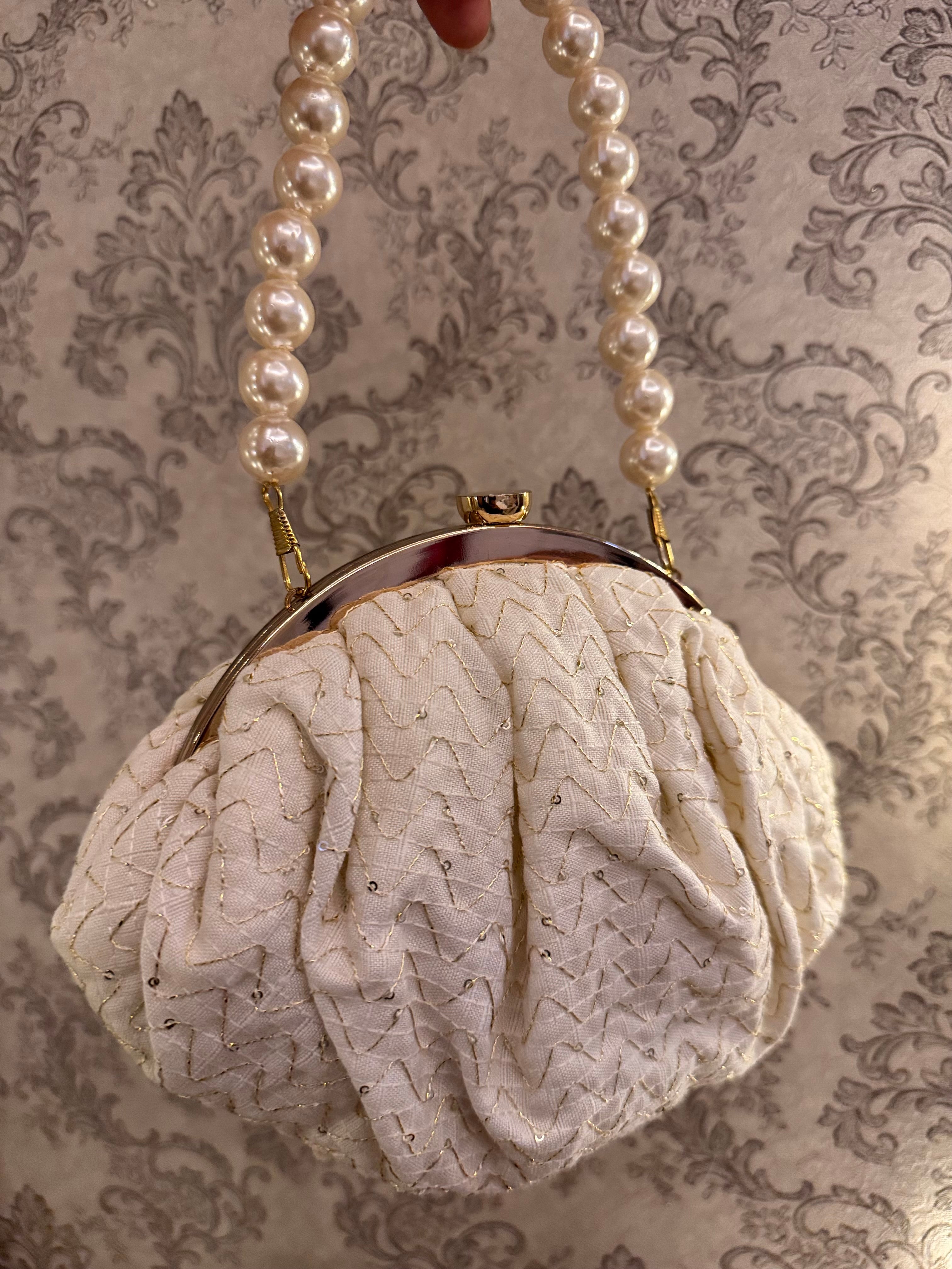 Pearl eclat clutch